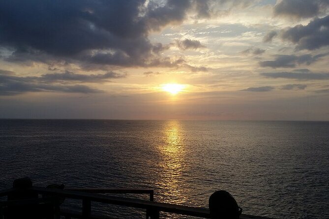 4. Negril Full-Day Guided / Sunset Tours 7miles Beach Blue Hole & Ricks Café - Rick’s Cafe: The 35-Foot Cliff Sunset Moment