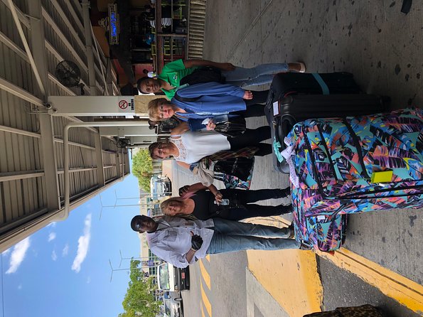 Airport MBJ Round Trip Transfers, to Montego Bay Airbnb & Resorts - Where the Pickup Happens: Sangster Arrival Section Meets a Signboard