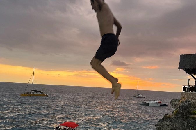 ATV Ride, Negril 7 mile Beach Catamaran Cruise & Ricks cafe Combo - Stop 3: Rick’s Cafe for Sunset, Cliff Jumping, Music, and Food