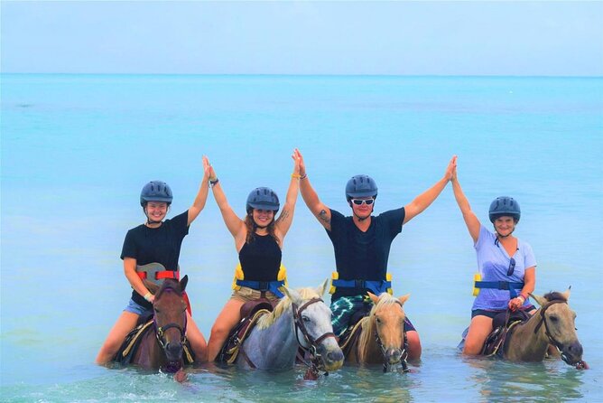 ATV, Zipline, Horseback, Bamboo Rafting & Catamaran Boat Jamaica - Catamaran party cruise with optional snorkeling: music, dancing, and sea time