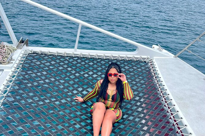 Bamboo Rafting, Catamaran Party Boat & Snorkeling In Montego Bay - The Dreamer Catamaran cruise: reggae, nets, and an open bar