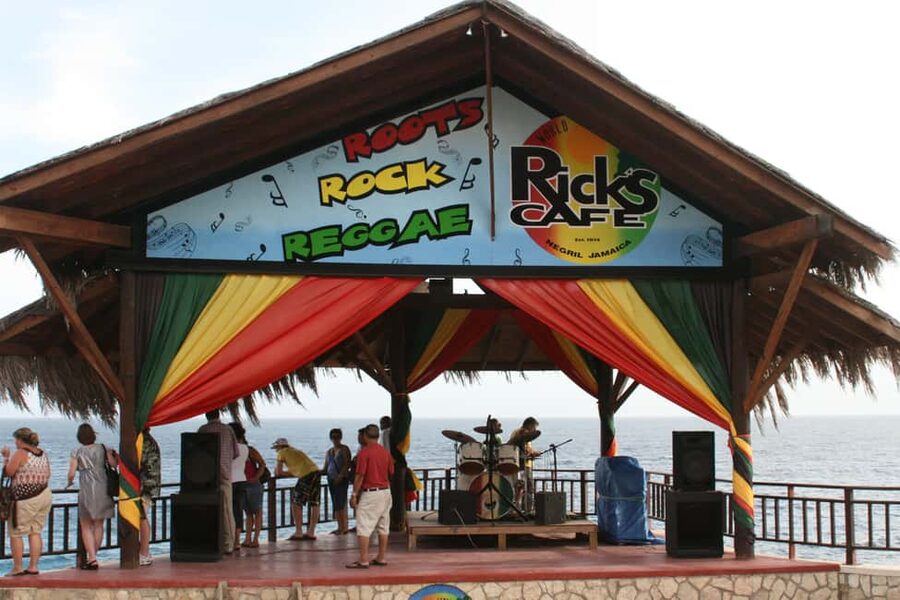 From Montego Bay: Negril Beach & Rick's Cafe Sunset Day Trip - Margaritaville beach stop: drinks, music, and a planned breather