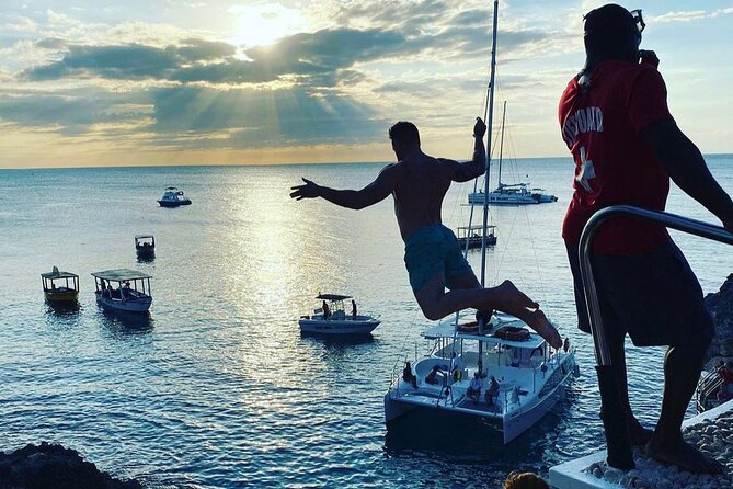 Negril 7 mile Beach, Party Catamaran Cruise , Snorkeling and Ricks Cafe Combo - Rick’s Cafe at sunset: free entry, DJ vibes, and cliff jumping as an option