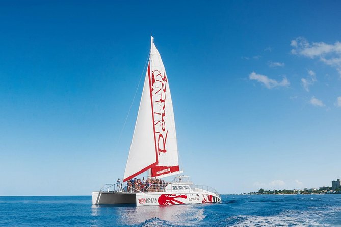 Reggae Family Catamaran Cruise From Montego Bay - Onboard reggae energy: DJ music, snacks, and the adult bar
