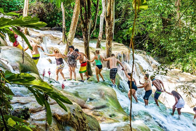 Zipline, Dunn’s River Falls, Bamboo Rafting & Horseback Ride Tour - Zipline over waterfalls: the adrenaline shift after wet steps